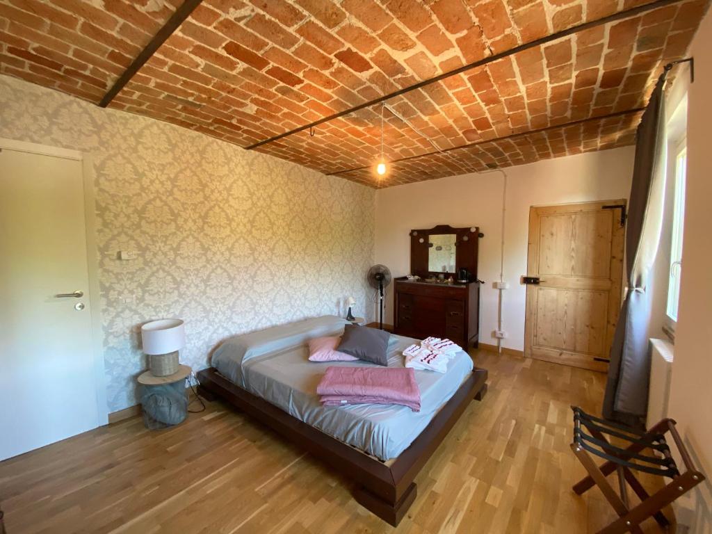 Postel nebo postele na pokoji v ubytování Il Noccioletto