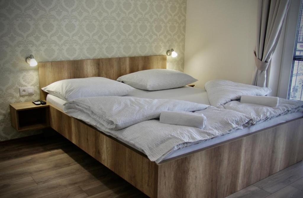 Postel nebo postele na pokoji v ubytování Jazmin apartmány