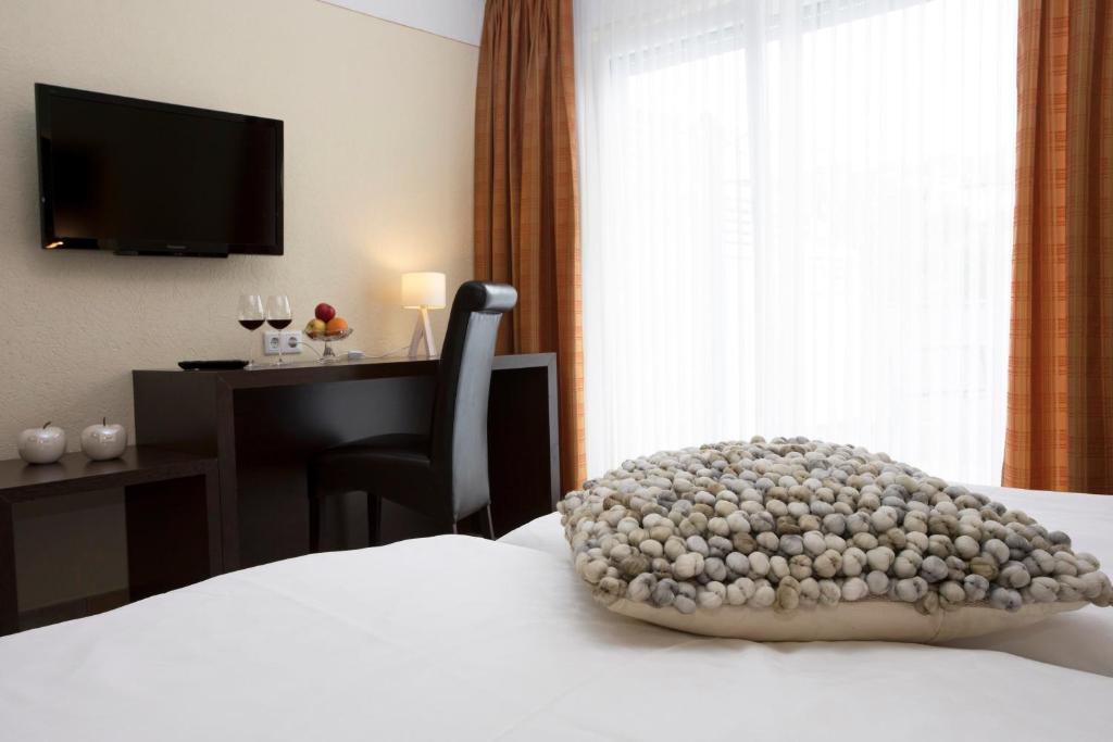 TV a/nebo společenská místnost v ubytování Hotel Forsthaus