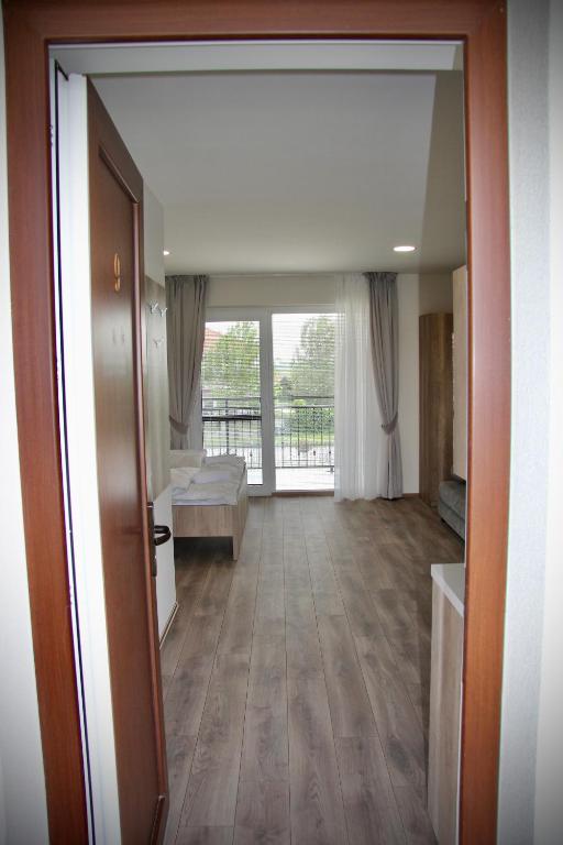 Postel nebo postele na pokoji v ubytování Jazmin apartmány