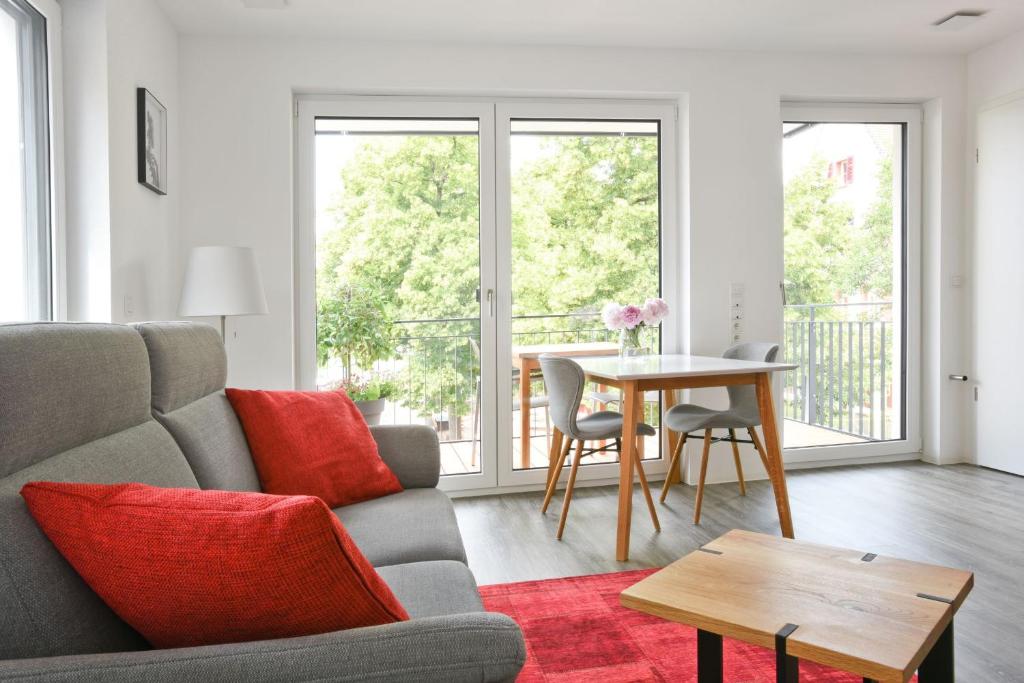 a living room with a couch and a table at City Appartement Kornwestheim in Kornwestheim