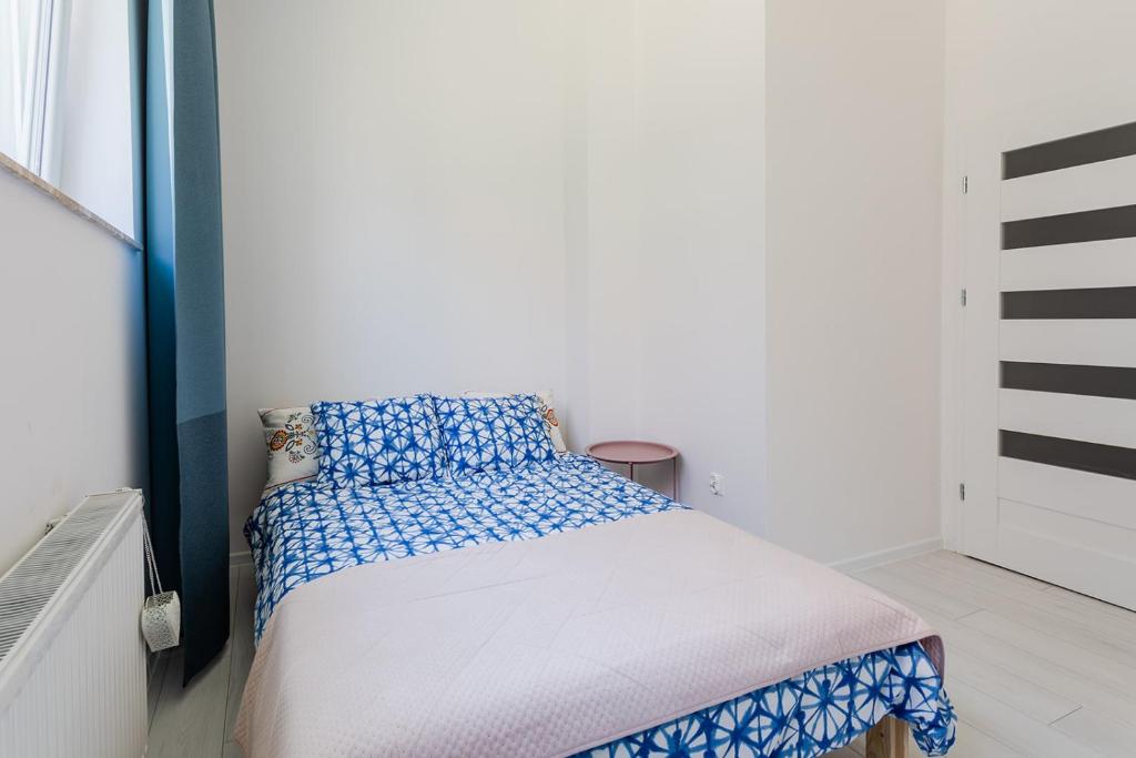 Posteľ alebo postele v izbe v ubytovaní Open Lakes Apartamenty Giżycko