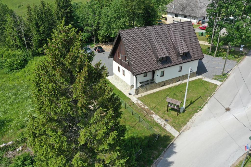 an overhead view of a white house with a brown roof at Natura Plitvice Lakes in Plitvička Jezera