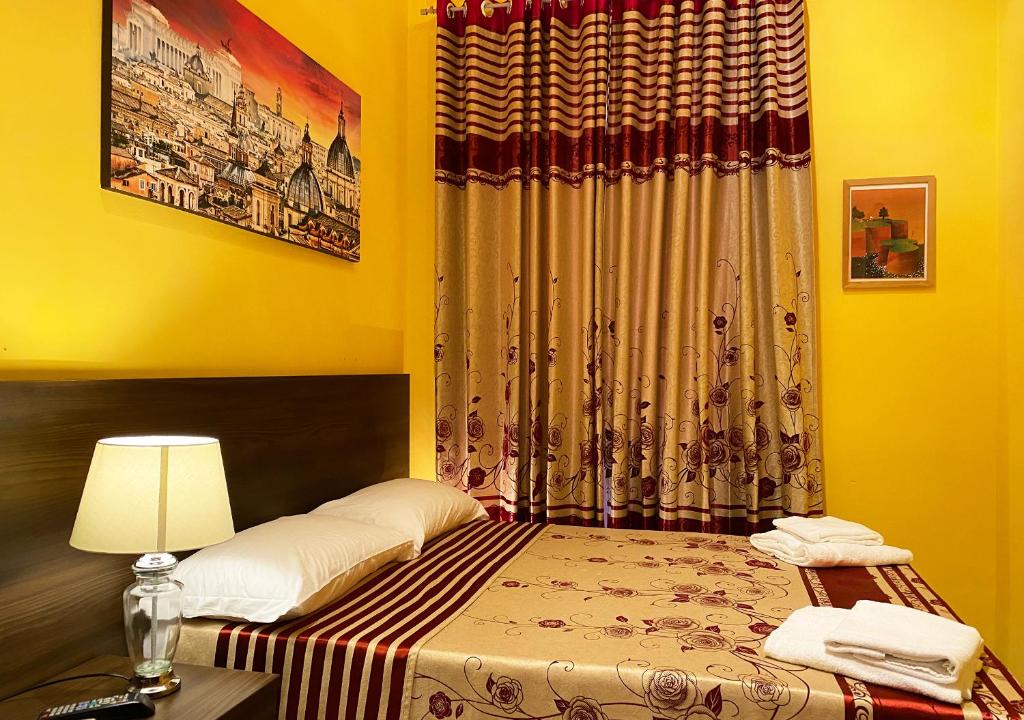 Postel nebo postele na pokoji v ubytování Sweet Dream Roma Termini