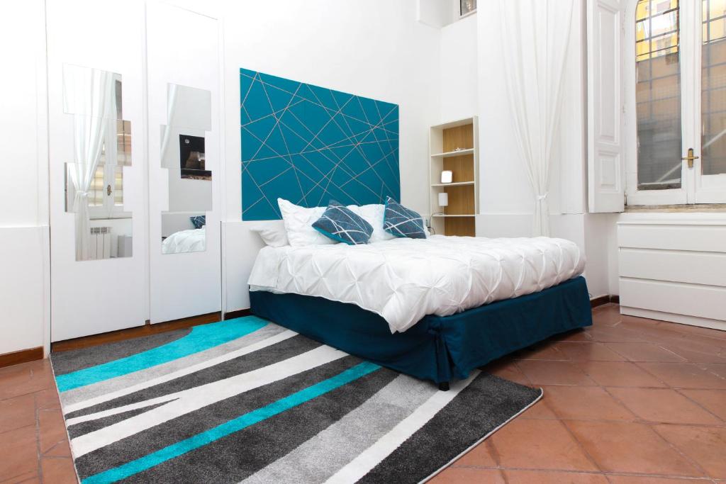 A bed or beds in a room at La Sirena a Mergellina