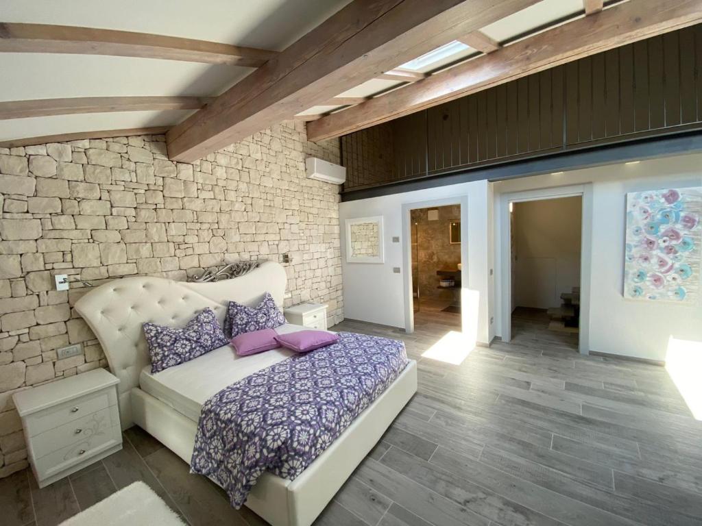En eller flere senge i et værelse på CASA MARTINELLI