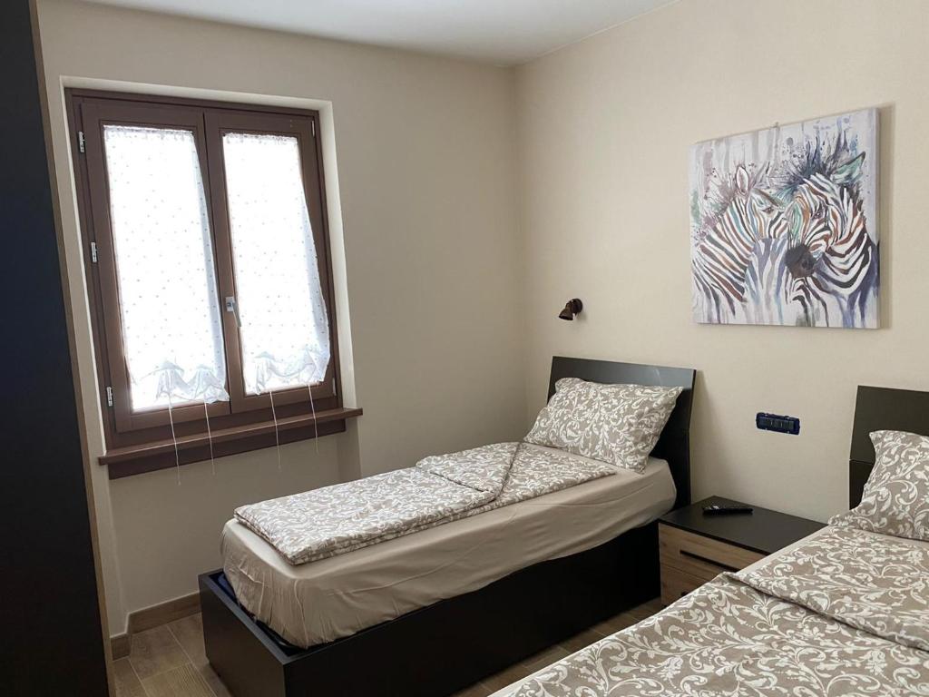Posteľ alebo postele v izbe v ubytovaní CASA MARTINELLI