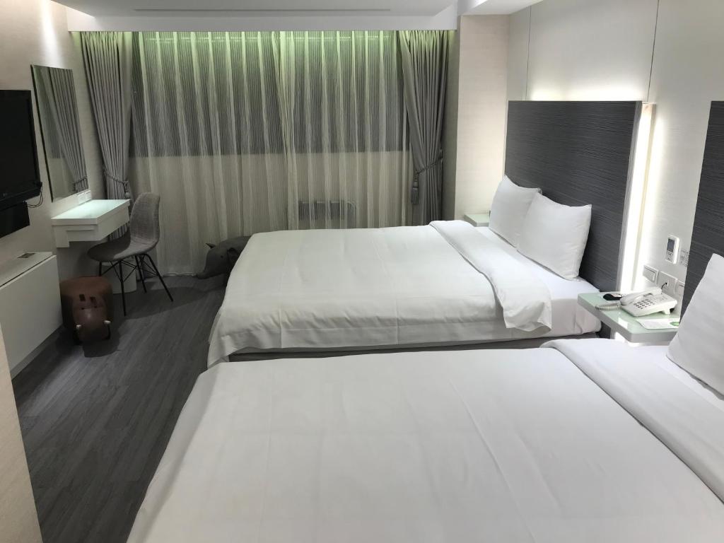 Golden Garden Hotelにあるベッド