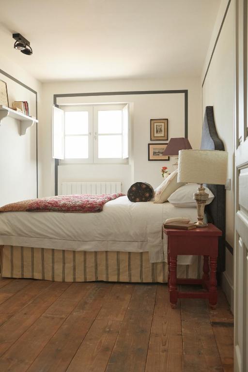 Postel nebo postele na pokoji v ubytování Hotel Caserio Aldeallana