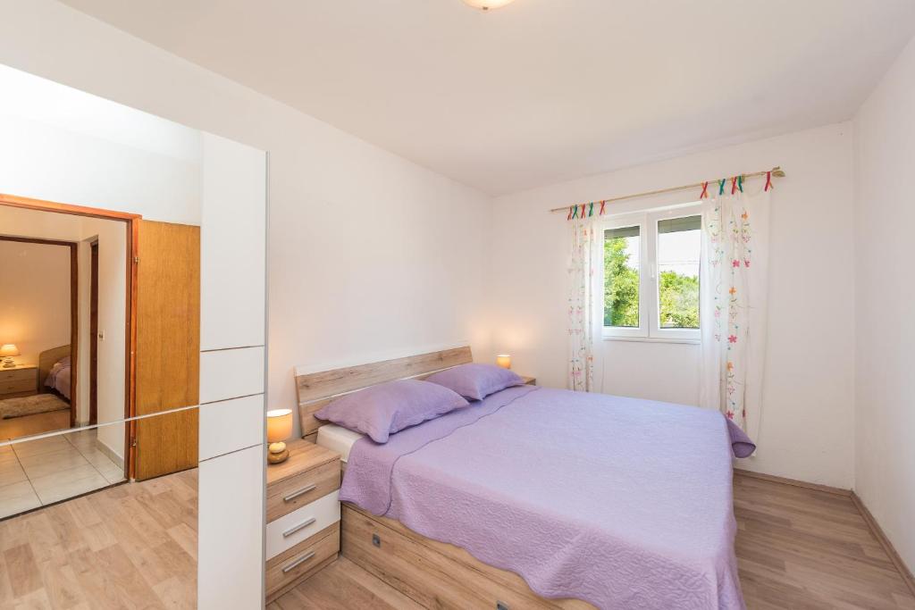 Postel nebo postele na pokoji v ubytování Nelly Apartments