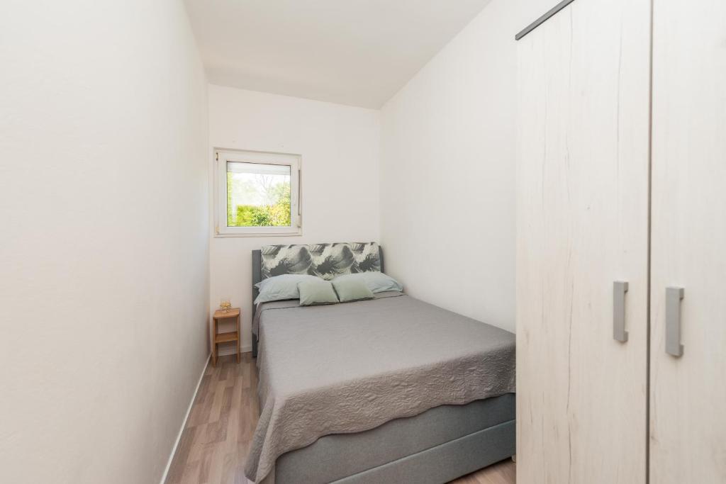 Postel nebo postele na pokoji v ubytování Nelly Apartments