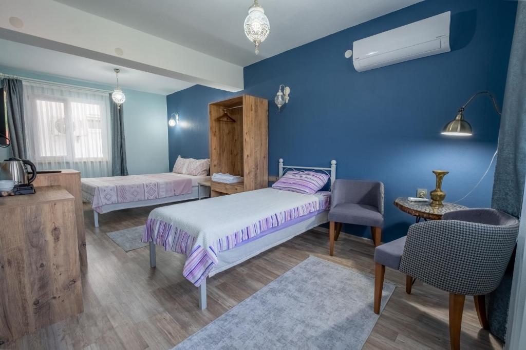 Postel nebo postele na pokoji v ubytování Sahika Konukevi