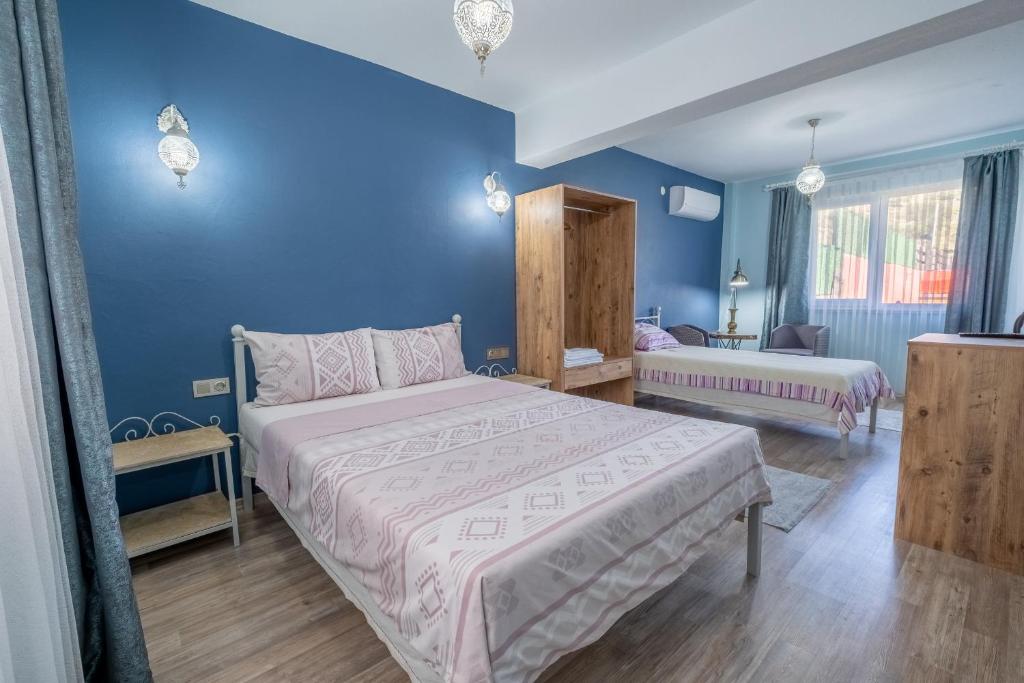 Postel nebo postele na pokoji v ubytování Sahika Konukevi
