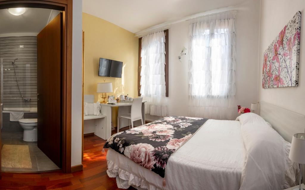 Posteľ alebo postele v izbe v ubytovaní Ca' degli Specchieri