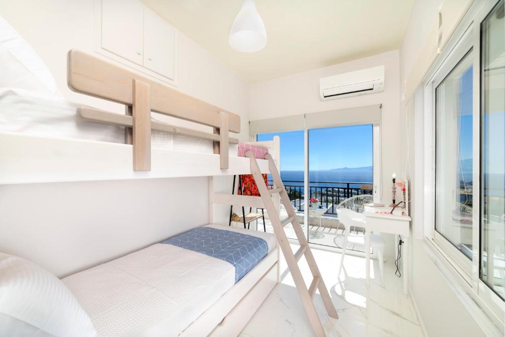 Postel nebo postele na pokoji v ubytování Elounda Buena Vista Apartments