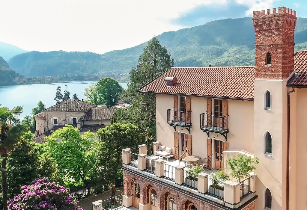a building with balconies and a view of a lake at Castellino Bella Vista in Ponte Tresa
