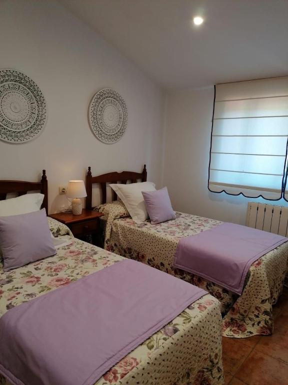 Posteľ alebo postele v izbe v ubytovaní Apartamentos Marsó