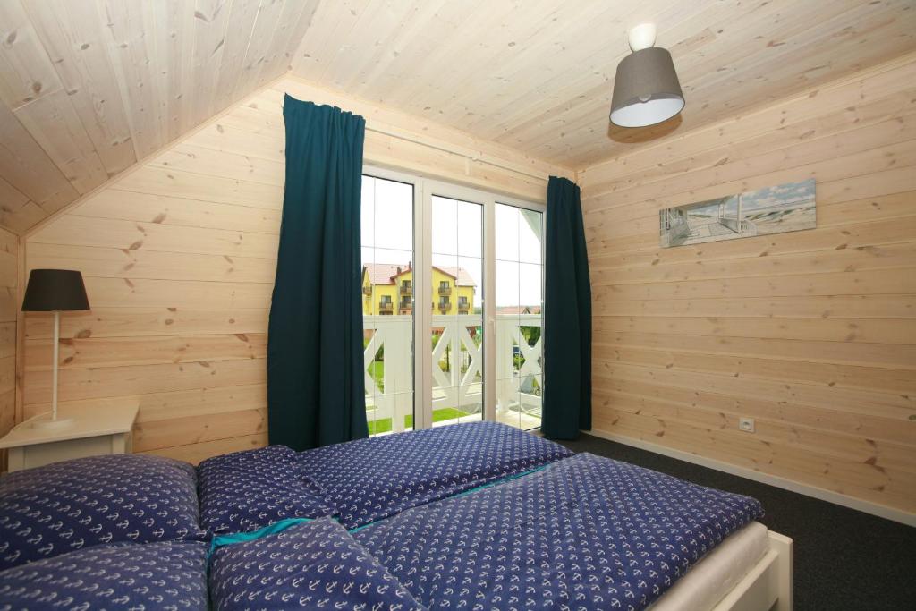 Postel nebo postele na pokoji v ubytování Domki Faro