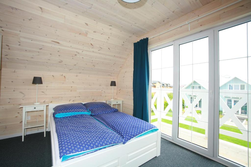 Postel nebo postele na pokoji v ubytování Domki Faro