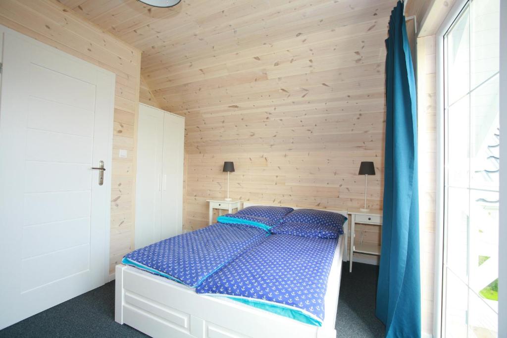 Postel nebo postele na pokoji v ubytování Domki Faro