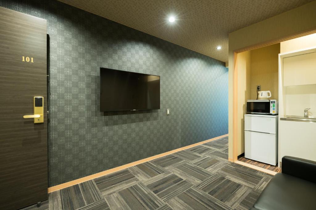 Kuchyň nebo kuchyňský kout v ubytování Shiki Suites - Kyoto Umekoji