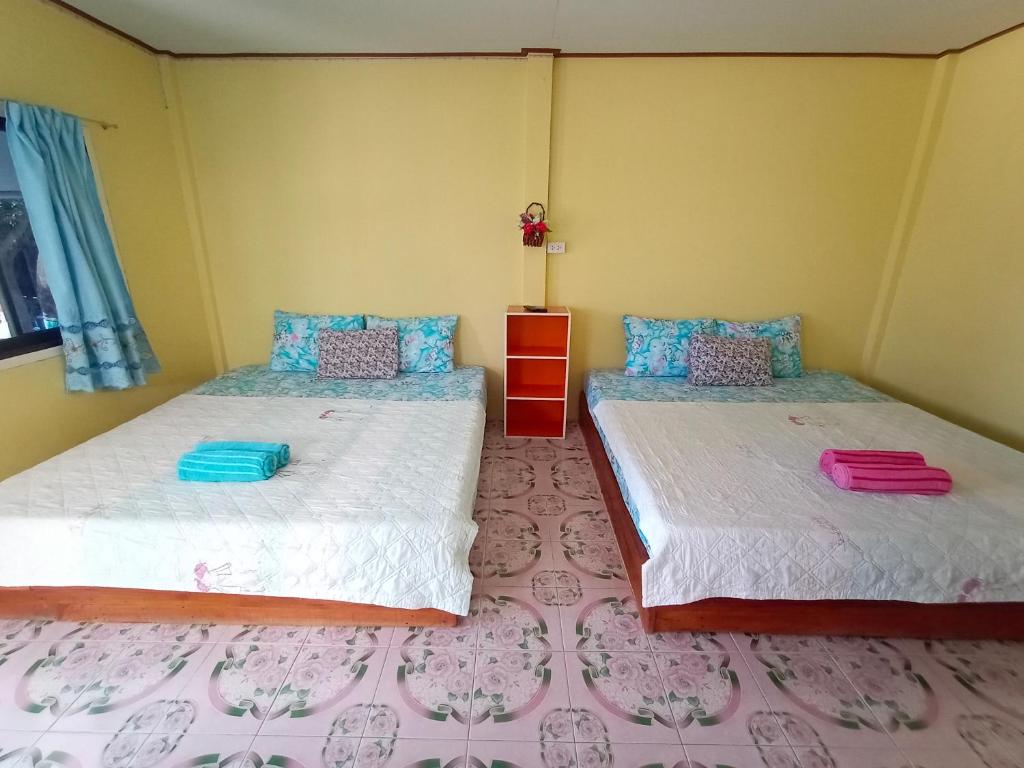 Postel nebo postele na pokoji v ubytování Lung Teeb Paradise Chao Lao Resort