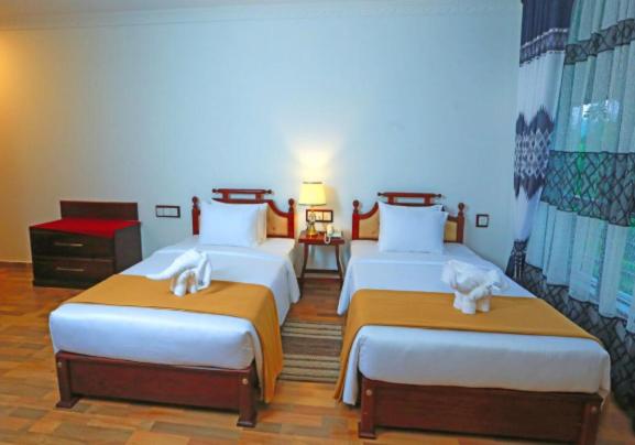 Postel nebo postele na pokoji v ubytování Centauria Hill Resort