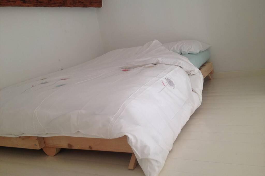 A bed or beds in a room at La Casetta