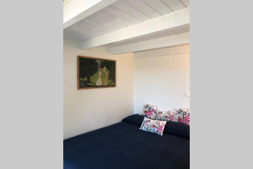 A bed or beds in a room at La Casetta