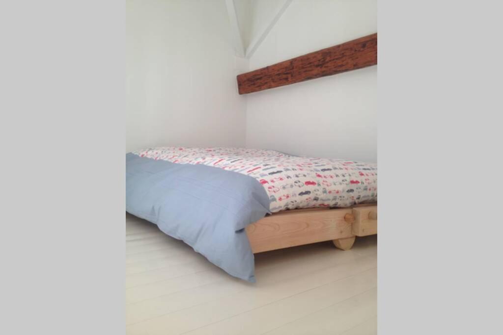 A bed or beds in a room at La Casetta