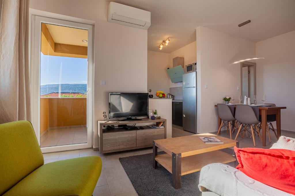 TV a/nebo společenská místnost v ubytování Apartment Leni