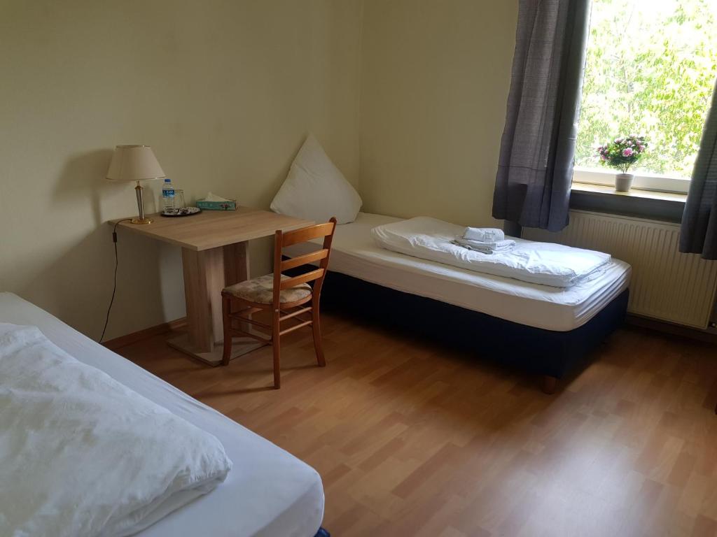 Ein Bett oder Betten in einem Zimmer der Unterkunft Landgasthaus Klosterhof