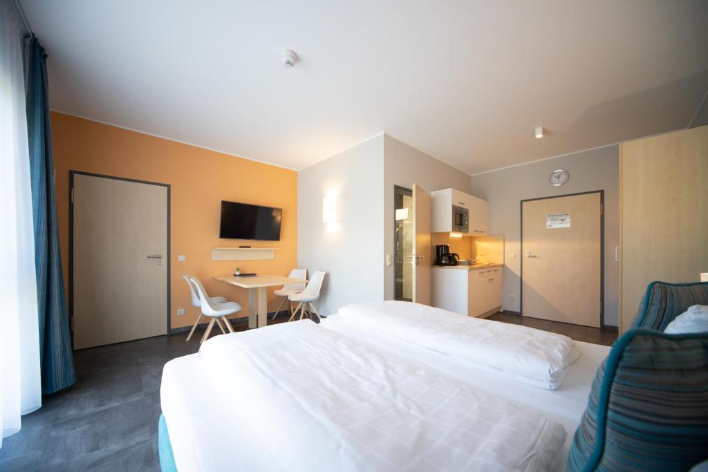 Postel nebo postele na pokoji v ubytování Riff Resort