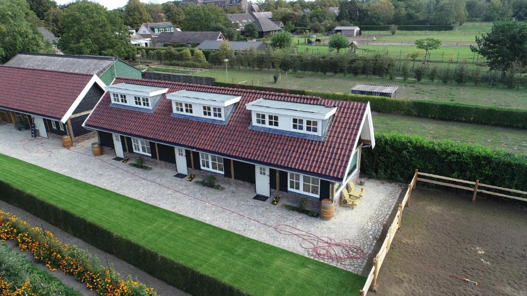 an aerial view of a house with a red roof at De Cromvoirtse Bed and Breakfast in Cromvoirt