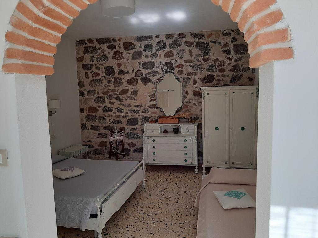Postel nebo postele na pokoji v ubytování B&B Sa domo de sos Massaios