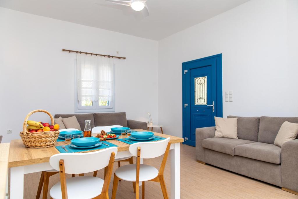a living room with a table and a couch at Oneiric Harmony in Mikri Vigla