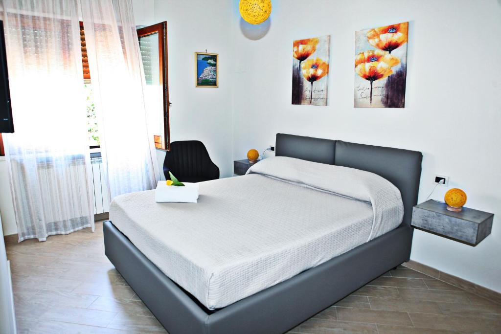 Postel nebo postele na pokoji v ubytování Mura Home Sorrento
