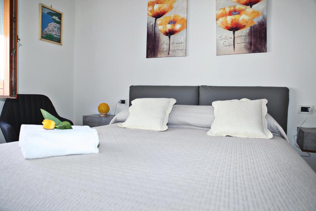 Postel nebo postele na pokoji v ubytování Mura Home Sorrento