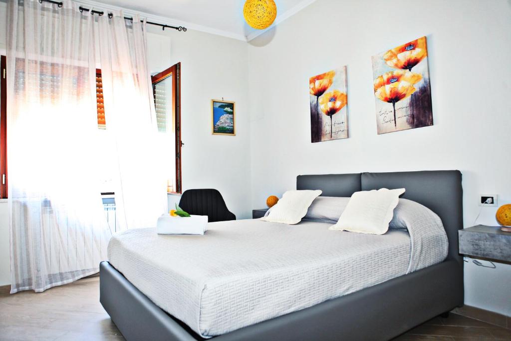 Postel nebo postele na pokoji v ubytování Mura Home Sorrento