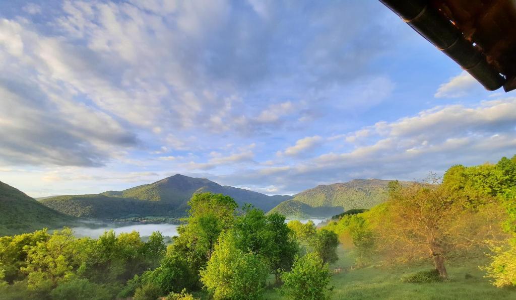 a view of a valley with a lake and mountains at L'Arbonnaise in Arbon