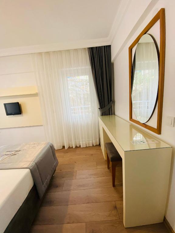 Postel nebo postele na pokoji v ubytování Melisa Hotel