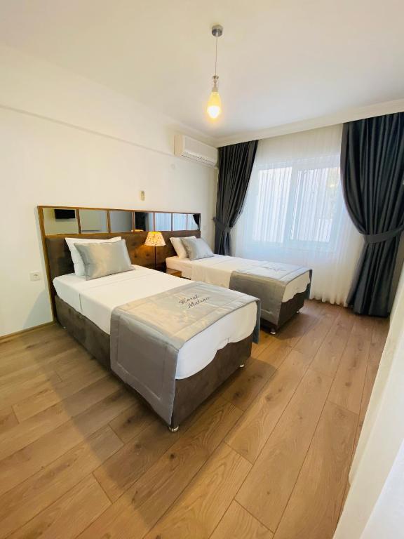Postel nebo postele na pokoji v ubytování Melisa Hotel