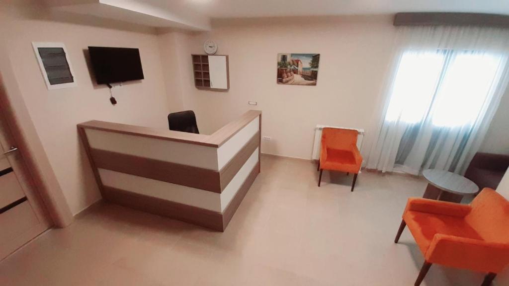 TV a/nebo společenská místnost v ubytování Pilon apartments
