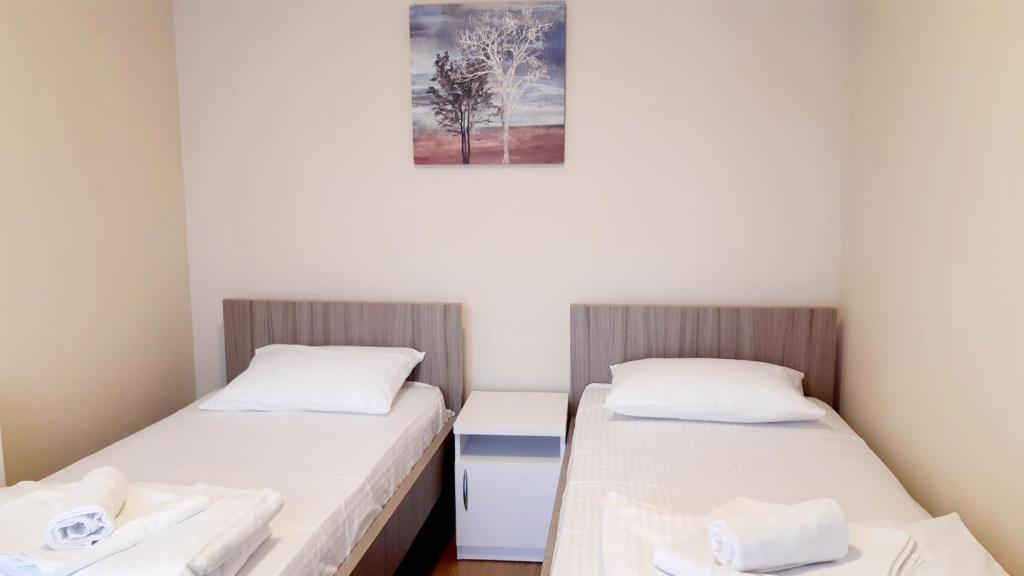 Postel nebo postele na pokoji v ubytování Pilon apartments