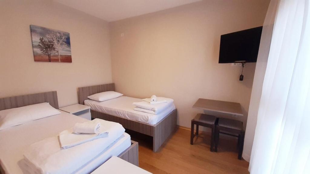 Postel nebo postele na pokoji v ubytování Pilon apartments