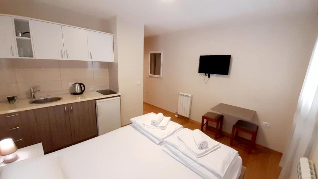 Postel nebo postele na pokoji v ubytování Pilon apartments