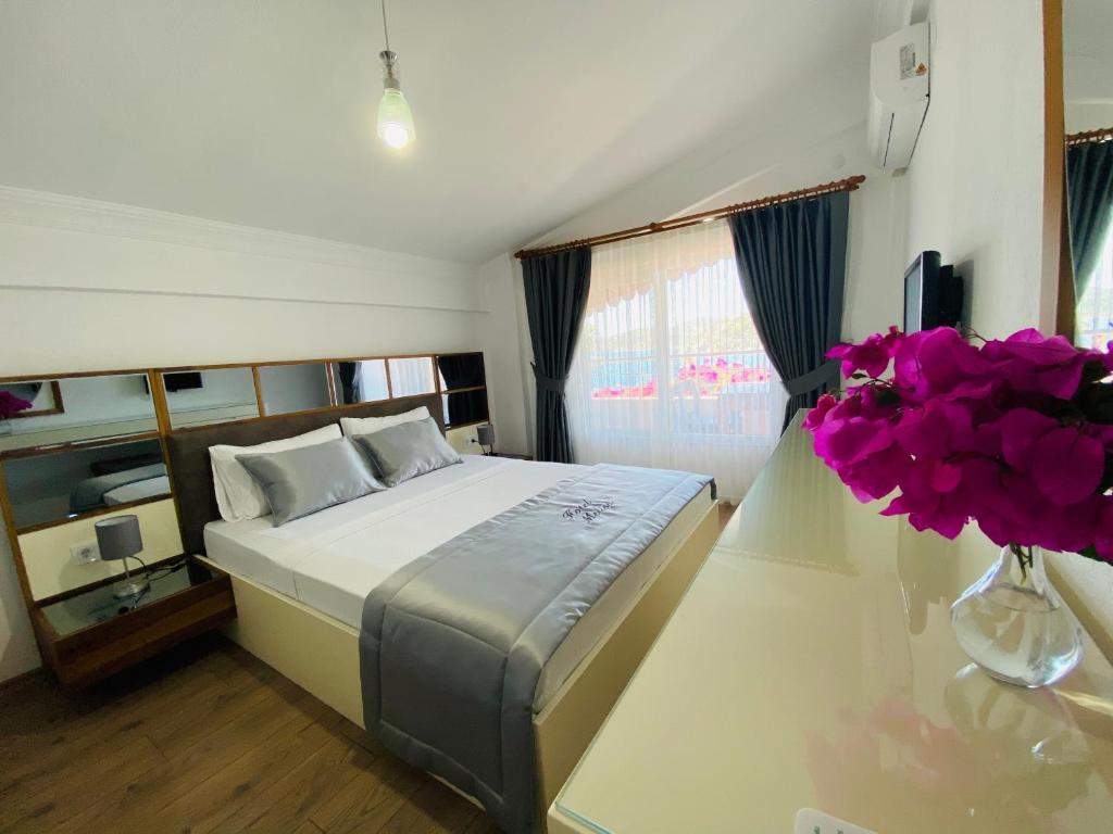Postel nebo postele na pokoji v ubytování Melisa Hotel