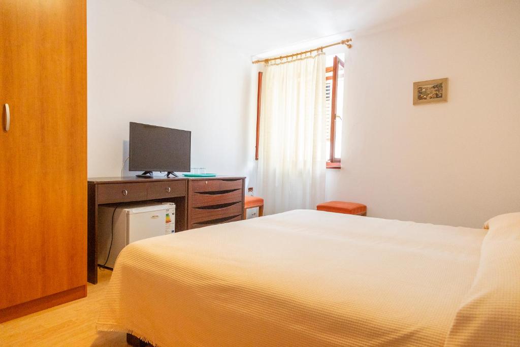 Postel nebo postele na pokoji v ubytování Rooms Anka