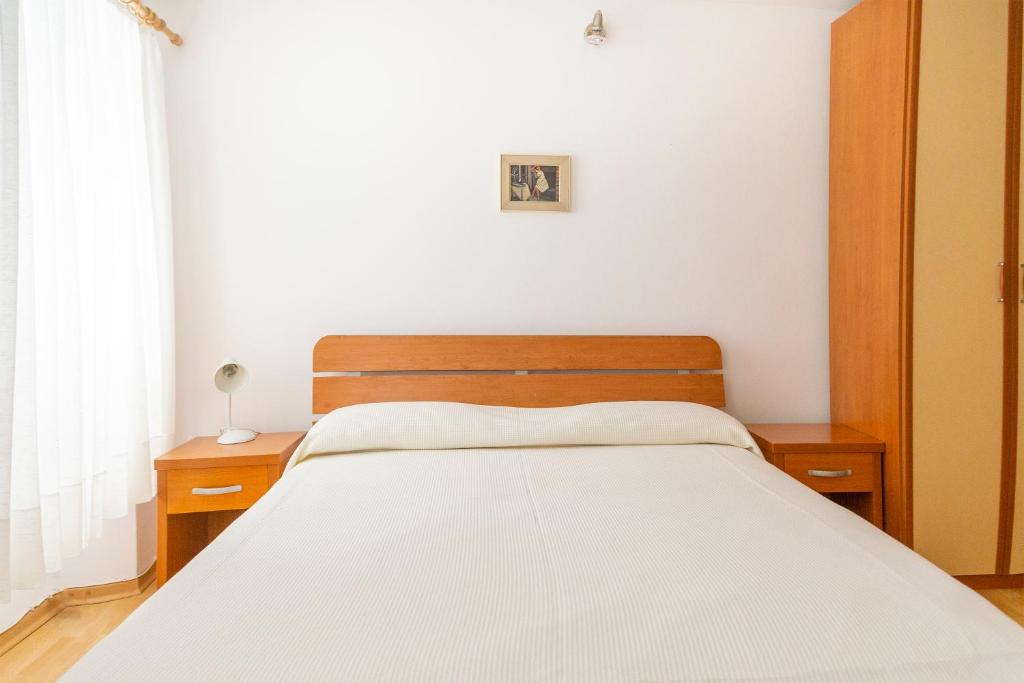 Postel nebo postele na pokoji v ubytování Rooms Anka