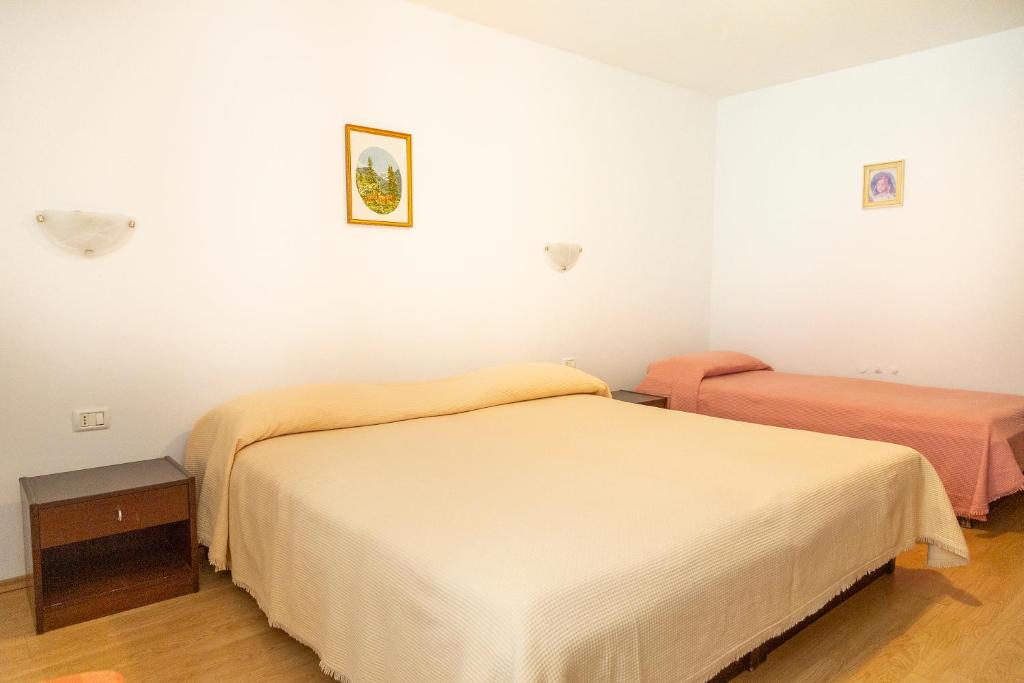 Postel nebo postele na pokoji v ubytování Rooms Anka